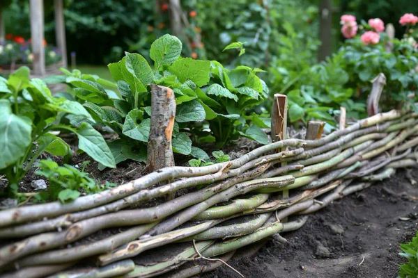 woven branches to fence your garden beds