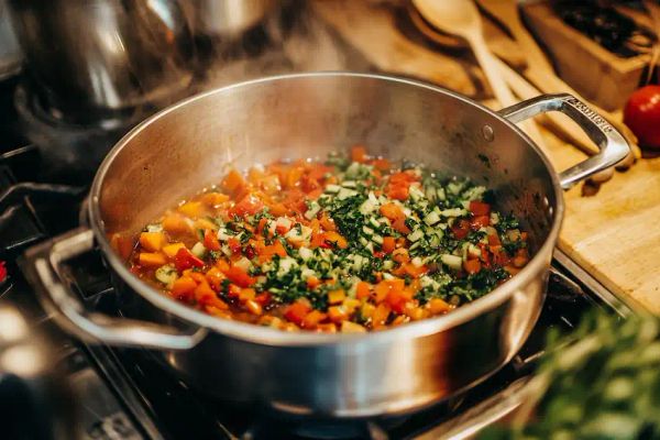 chopped vegetables being sauteed in sunflower oil