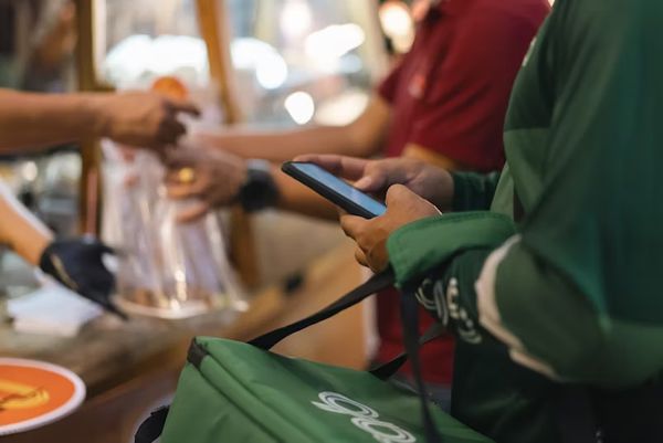 person waiting in line at grocery store